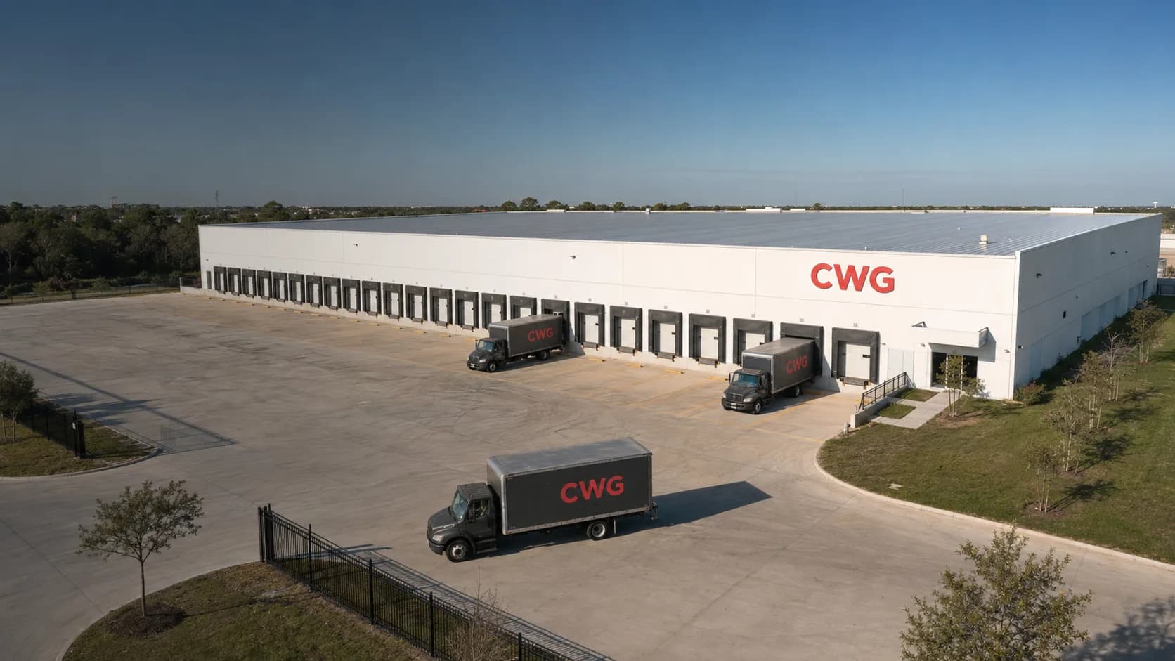 Aerial view of the CWG Solutions cross-dock warehouse in Houston with trucks staged at the dock doors